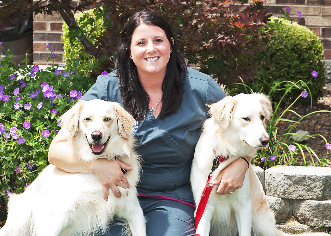 Carousel Slide 4: Hospital Manager Gina with Dogs